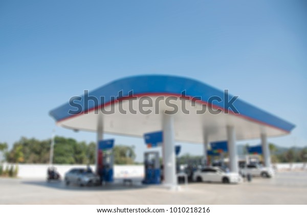 Blur image of gas station in day\
time.selective focus petrol pump station for\
background