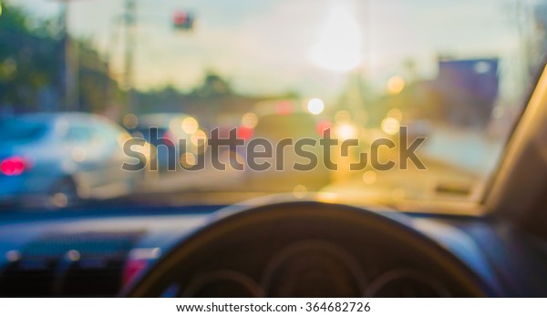 blur image of inside car with bokeh on evening\
time for background