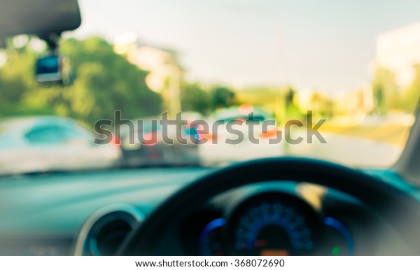 blur image of inside car with bokeh on\
day time for background usage. (vintage \
tone)