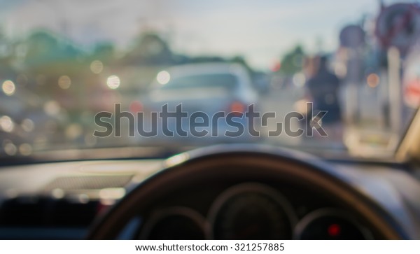 blur image\
of inside cars with bokeh on day\
time.