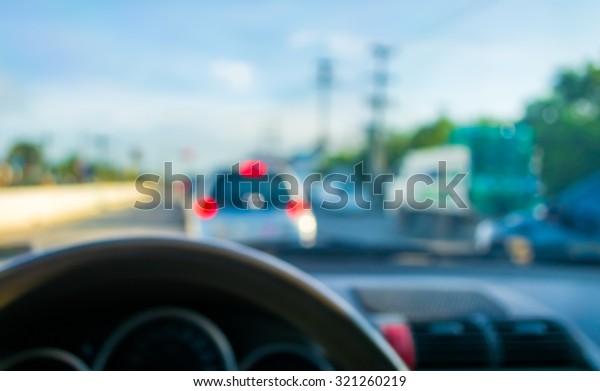 blur image
of inside cars with bokeh on day
time.