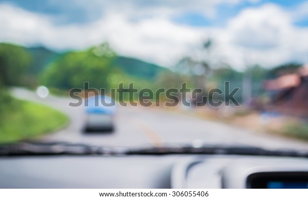 blur image of inside cars to see the\
road  with bokeh lights for background\
usage.