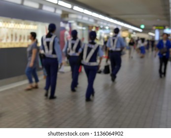 Blur Image Of Japanese Police Walk Around The Subway Station For Security Check