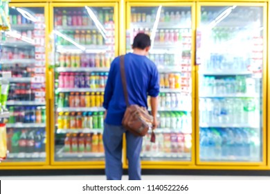 Blur Image Of Laborers Are Looking For The Drinks They Need In Beverage Cooler.