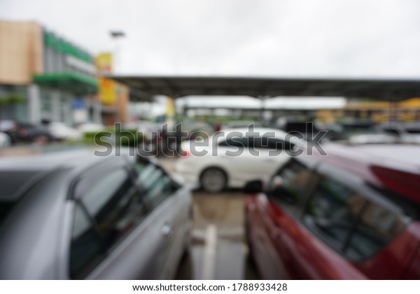 Blur image mall parking\
lot.