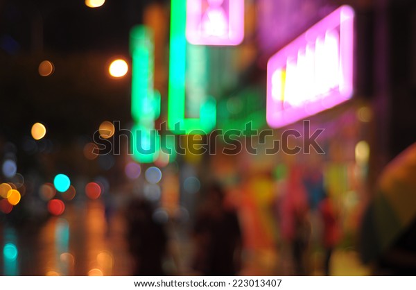 Blur\
image of Masjid India Street at night with\
bokeh