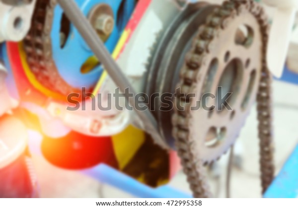Blur image of mechanism gear with\
chain, chain and cogwheel in machine system, vintage\
color.