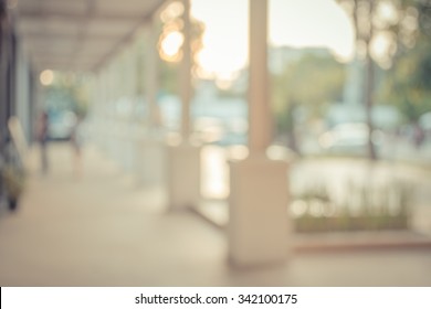 blur image of modern building on day time for background usage.