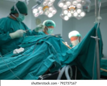 Blur Image Of Neuro Surgeons Team Working In Operative Room