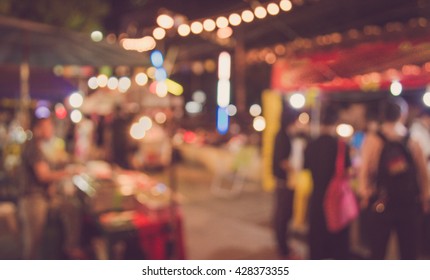 Blur Image Of Night Festival On Street Blurred Background With Bokeh . (vintage Tone)