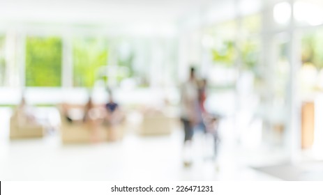 blur image of people sit in living room .