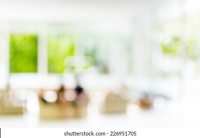Blur Image Of People Sit In Living Room For Background.