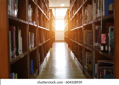 Blur image of picture library background. Library resources, including vast knowledge and sun light. School classroom in blur background. blurry view of elementary class room.