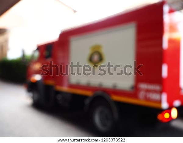 Blur\
image Red fire truck, Abstract blurred red fire truck emergency\
vehicle, Abstract blur and defocused Red fire\
truck.