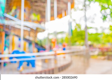 Blur Image Of Roundabout In Theme Park For Background Usage.