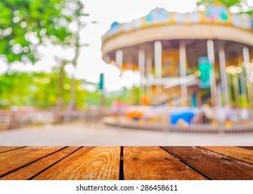 Blur Image Of Roundabout In Theme Park For Background Usage.