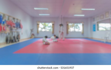 Blur Image Of Taekwondo Class With Teacher And Student For Background.