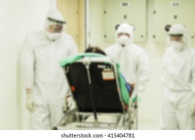 Blur Image Of  Worker  Moving  Patients Suspected Ebola To Hospital