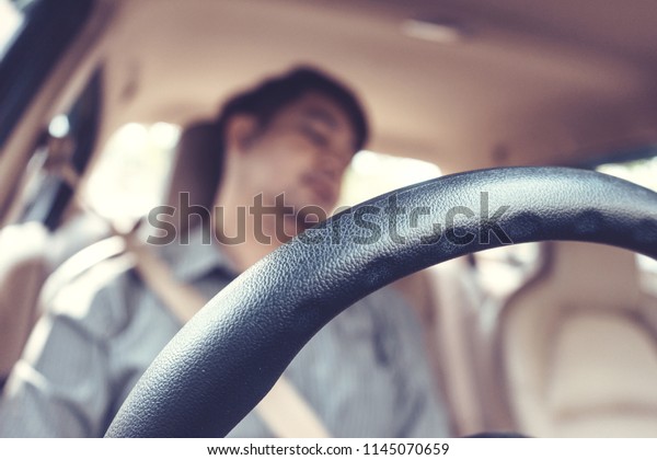 Blur image,man be tired
sleep in car