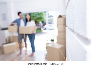 Blur images of couple, husband and  wife helping each other to lift the box Happily, to move into a new home For starting a marriage and family life. - Shutterstock ID 1787360465