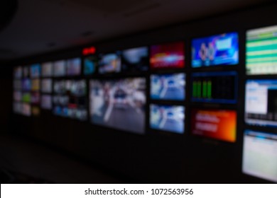 Blur Images Of Multiple Television Broadcast. In Master Control Room.