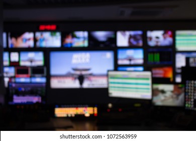 Blur Images Of Multiple Television Broadcast. In Master Control Room.