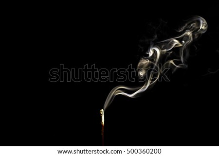 Blur Incense Stick with Smoke on Black in black and white abstract background.