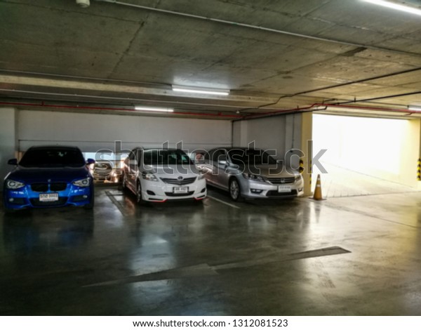blur indoor\
parking lot with orange light \
