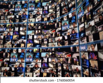 Blur large LED screen show many people's faces join big online event or virtual reality live conference. Big video call seminar, Work from home, Social distancing, New normal event production. - Shutterstock ID 1760060054