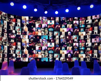 Blur large LED screen show many people's faces join big online event or virtual reality live conference. Video conference, Work from home, Social distancing, New normal event production.  - Shutterstock ID 1764329549