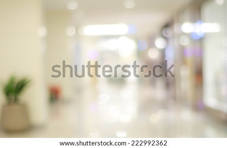 Blur light background at shop in mall for business background, blurry abstract bokeh at interior hallway