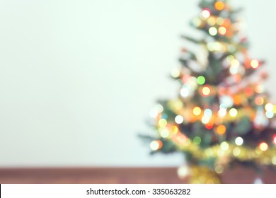 Blur Light Celebration On Christmas Tree With White Wall Background