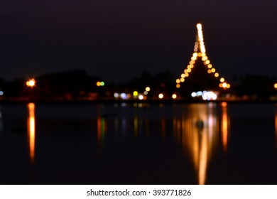 Blur light on temple in the night with water reflection. - Shutterstock ID 393771826