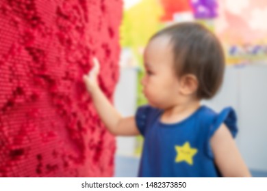 Blur Of Little Cute Girl Playing Red Pin Art Board. Concept Of Play Development. 