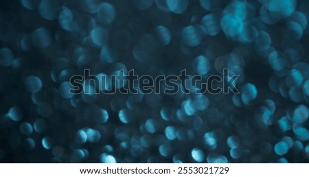 Blur luminosity. Blue highlights. Variable dispersion with illuminated colored spots. Festive background with airy mystical glitter.