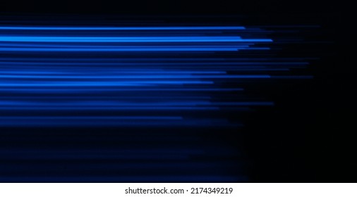 Blur luminous rays. Glowing neon banner. Cyber flare. Defocused ultraviolet navy blue color light lines motion on dark black futuristic abstract background.