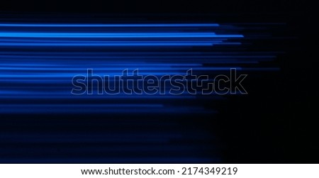 Blur luminous rays. Glowing neon banner. Cyber flare. Defocused ultraviolet navy blue color light lines motion on dark black futuristic abstract background.