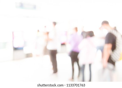 Blur Of Many People At The Bus Station Background