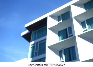 Blur Modern Urban Apartment Building Exterior In Evening.