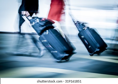 Blur motion of passengers walking at airport in blue color filter