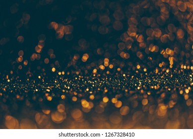 Blur Neon Gold And Blue Light Circle Background. Sparkling Firework Bokeh Dots In Vintage Style. Luxury And Classy New Year And Christmas Celebration Party Textured Dark Backdrop. Blurry Golden Dust.