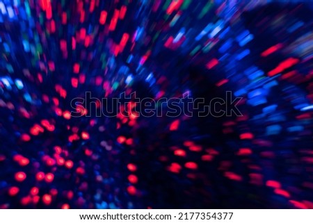 Blur neon light. Bokeh glow flare. Firework sparks. Defocused fluorescent navy blue red color explosion glare strokes lines motion on dark night black abstract background.