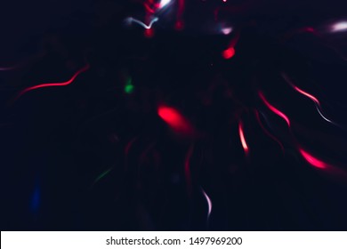 Blur Neon Magenta Sparks. Defocused Illuminated Wavy Lines. Dark Abstract Art Background.