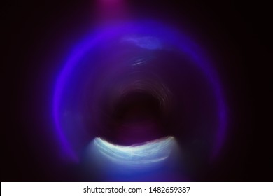 Blur Neon Purple Arc Glow. Colored Lens Flare. Dark Abstract Background. Tunnel Effect.