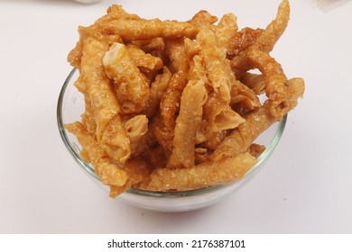 blur and noise image of a bowl of ting-ting on white background