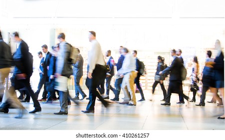 Blur Of Office Workers Walking Pass The Canary Wharf Tube Station In Early Morning Rush Hours