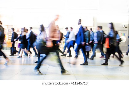 Blur Of Office Workers Walking Pass The Canary Wharf Tube Station In Early Morning Rush Hours