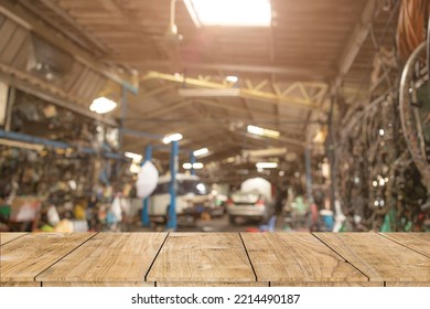 blur old garage interior with wooden table space for car service products advertising montage background - Powered by Shutterstock