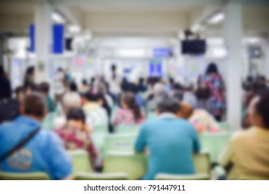 Blur Of Outpatients And Family Sitting To Meet A Doctor As Their Medical Appointment On Weekday At Examination Room In The Public Hospital, Thailand. Waiting To Meet A Doctor Concept.