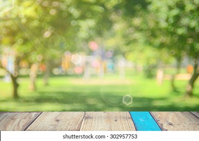 Blur Park With Nature Green Bokeh On Wood Abstract Background.